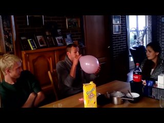 Girl watches how retard guy blows up a balloon and pops it on someones head