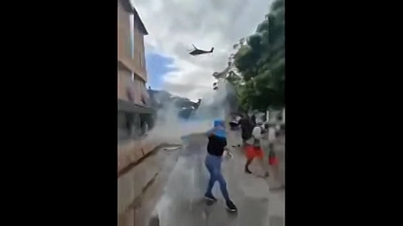 Colombian army is now shooting and throwing smoke grenades at people from Black Hawk helicopters.
