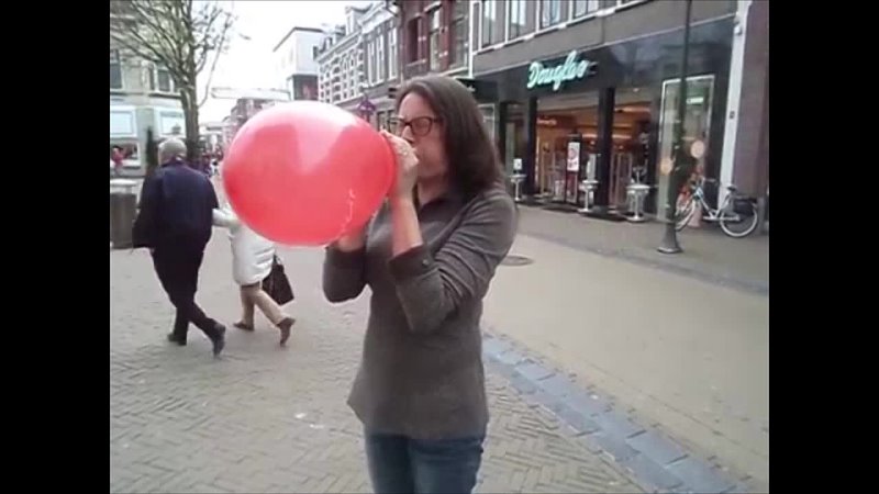 Red balloon bursting girl