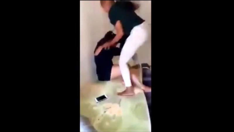 Young black girl, fighting and beating the hell out of an old black