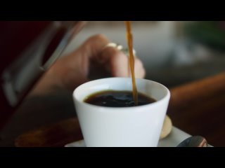 Pouring coffee in a mug