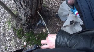 My boyfriend holding my cock pissing together in the woods