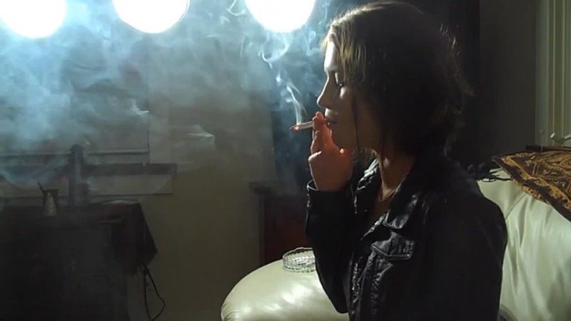 Woman smoking cigarette with deep