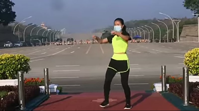 The masked fitness instructor from Myanmar inadvertedly dancing to the exact moment her country became a