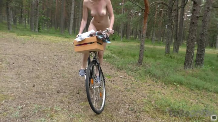 Sonja naked bike riding in the forest then masturbating