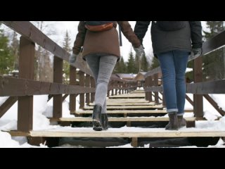 A Winter Landscape And Couple Crossing