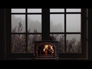 Rain_on_window_-_crackling_fire_and_misty_atmosphere_for_sle