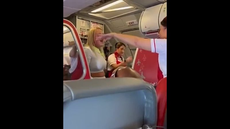 After complaining about crying babies the woman slapped two passengers, forcing the flight to divert