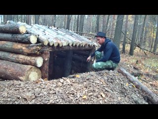 Chewing alone. Underground shelter in the wild forest almost done. Bushcraft