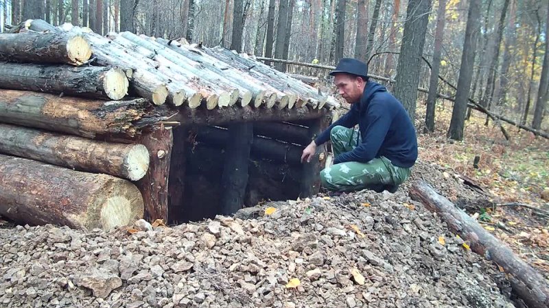 Chewing alone. Underground shelter in the wild forest almost done.