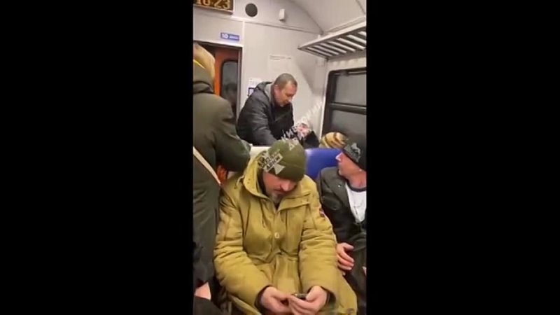 AN OLD LADY IS ASSAULTED BY TWO MEN IN A TRAIN IN KIEV FOR SAYING RUSSIA CAME TO