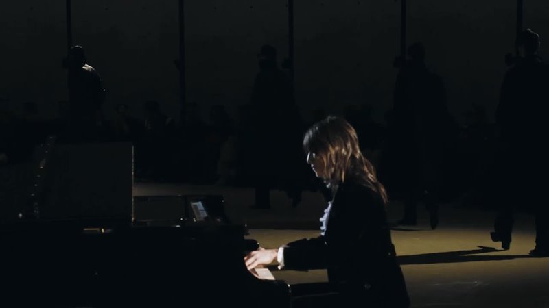 Charlotte Gainsbourg playing piano at SAINT LAURENT MENS WINTER 23