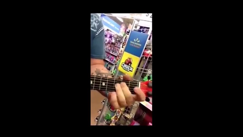 Dude shreds on a toy guitar, and shows off his vocal