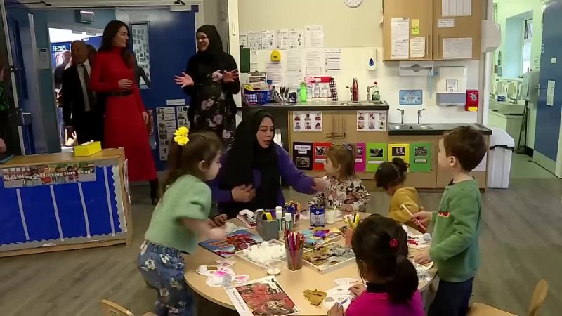 Kate plays with kids during nursery