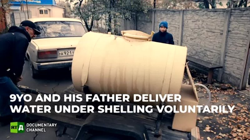 9-year-old Boy and his Father deliver water to the residents of Donetsk - RT Documentary