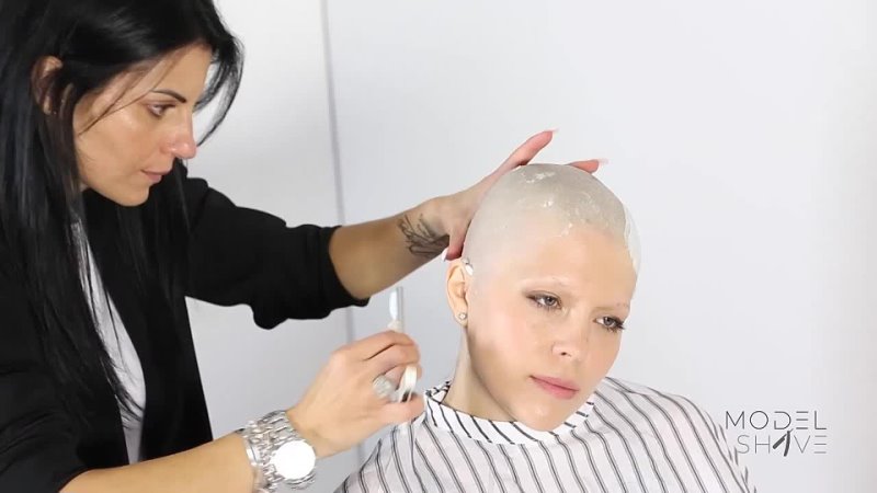 V for bald blonde girl hair and eyebrows shaved.  [Trailer]
