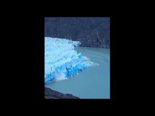 Rare footage of when an iceberg flips and a Blue Iceberg is formed