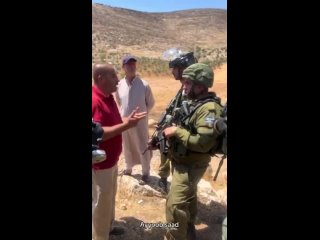 A brave Palestinian confronts an Israeli occupation soldier during the weekly protest against illegal settlement expansion in Be