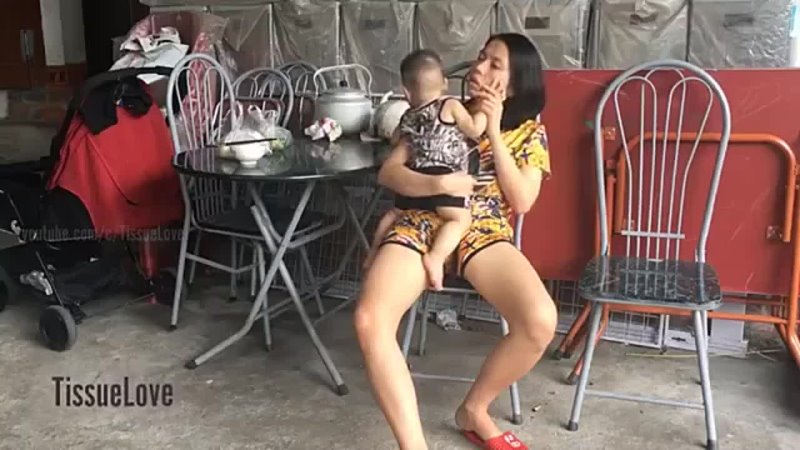 milf Mother breastfeeding son in the yard at grandmother's 