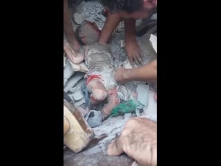 An innocent baby was just pulled out from under the rubble of her home in Nusseirat refugee camp, central Gaza, which had been l