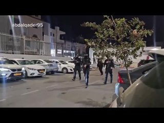 The Israeli occupation police detain a number of Palestinians during a protest in solidarity with Gaza in Umm Al Fahim town in t