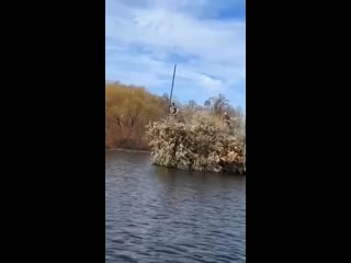 The Armed Forces of Ukraine camouflaged one of their boats on the waters of the Dnieper River as a floating bush