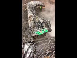 Pressure washing the paint off a Plymouth roadrunner fender after a chemical dip