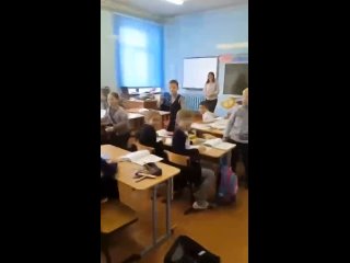 Students and colleagues meet with a teacher at one of the schools in the Russian Federation, who came on vacation from the zone