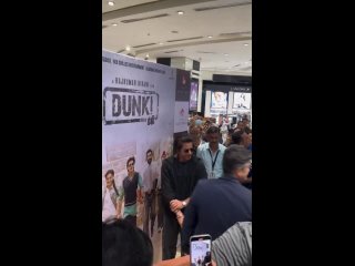 Shah Rukh Khan spotted snapping at the Dunki Stand at the Duty free section at the Mumbai Airport.