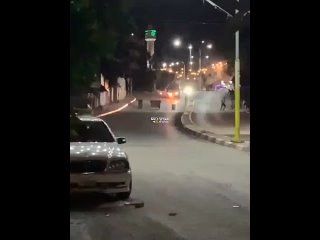 Throwing a Molotov cocktail at an jevvish genocidal army vehicle in the town of Azzun, east of Qalqilya