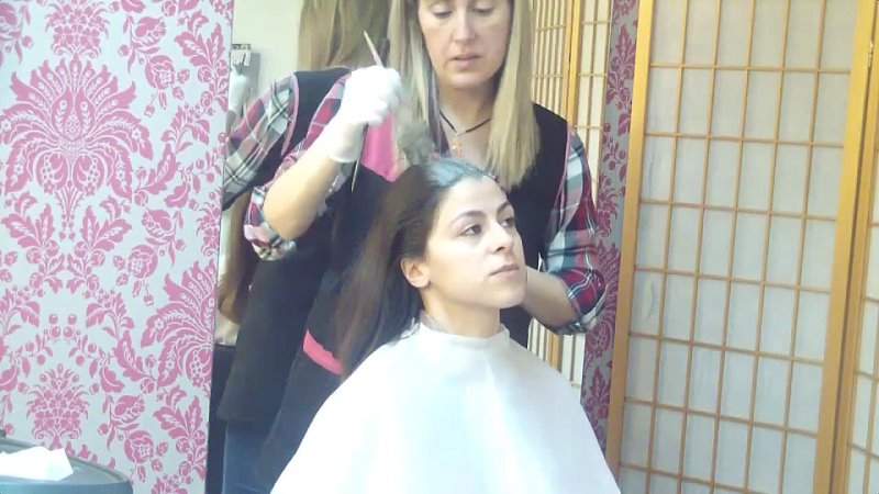 null - Cutting dry long hair in a young brunette