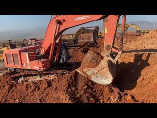 Hitachi Zaxis 670LC Excavator  Caterpillar Excavators Loading Mercedes  MAN Trucks