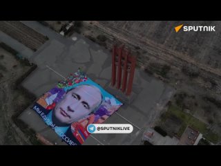 Армянские волонтёры огромным баннером поздравили Путина с победой на выборах