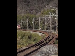 These beautiful trains going down the same track somewhere in Japan.