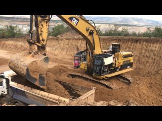 Caterpillar 365C Excavators Loading Trucks With Three Passes