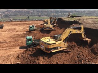Four Caterpillar 365C Excavators Loading Trucks On The Line