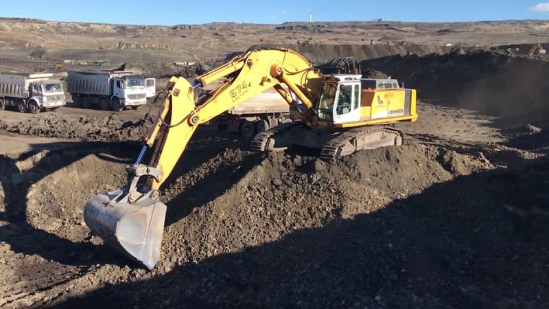 Liebherr 974 Excavator Loading Trucks With Three