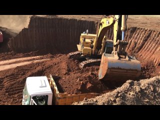 Three Caterpillar 365C Excavators And One Caterpillar 245 Loading Trucks