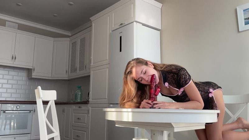 Mary Rock fucked herself with a dildo on the kitchen