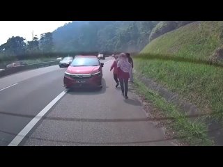 Car conflict on the highway. Malaysia.