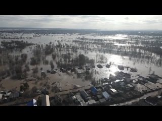 Record floods swept across Russia and neighboring regions