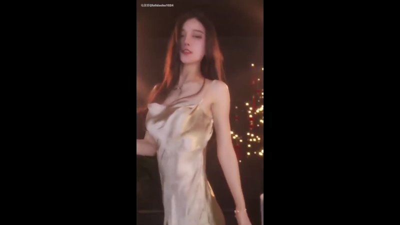 Sexy lady dancing in golden satin slip dress 