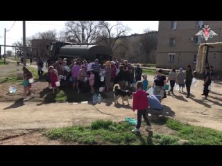 Nuclear, Chemical, and Biological Protection specialists of the Yasny Missile Formation conduct disinfection of areas flood-affe