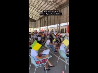 Ничего особенного, просто студенты одного из филиппинских колледжей сдают экзамен в специальных шапочках, которые не дают им под