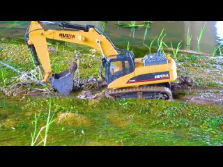 RC Tractor Bulldozer 4x4 is pulled out of the mud by Powerful Excavator