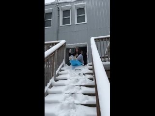 The way the snow slides off the railing and directly onto her at the end