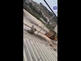 Israeli army in the West Bank destroying roads of Palestinians