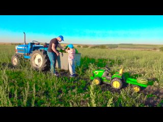 Darius and daddy ride tractors on the watermelon field and pick some last season fruits