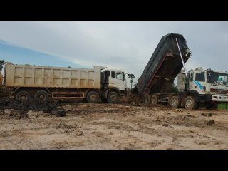 Heavy Loading Dump Truck Unloading Sticker Dirt Bulldozer Pushing Dirt Into Water Extreme Landfill