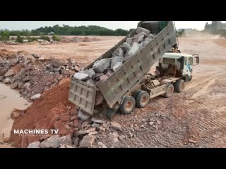 Huge Land Reclamation Process Dump Truck Management Unloading Rock Dirt Bulldozer Pushing Stone